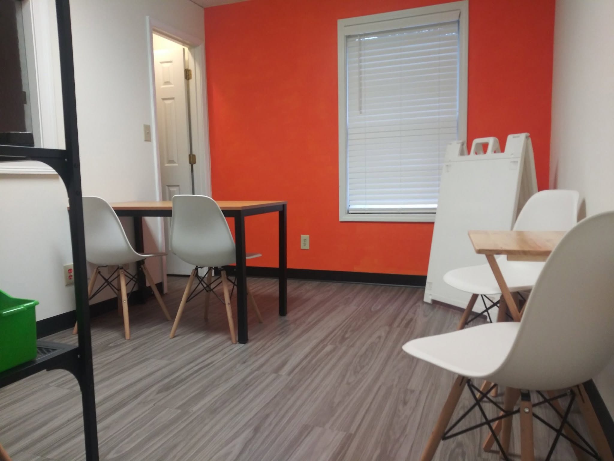 The Academic Medics learning space with small tables and chairs